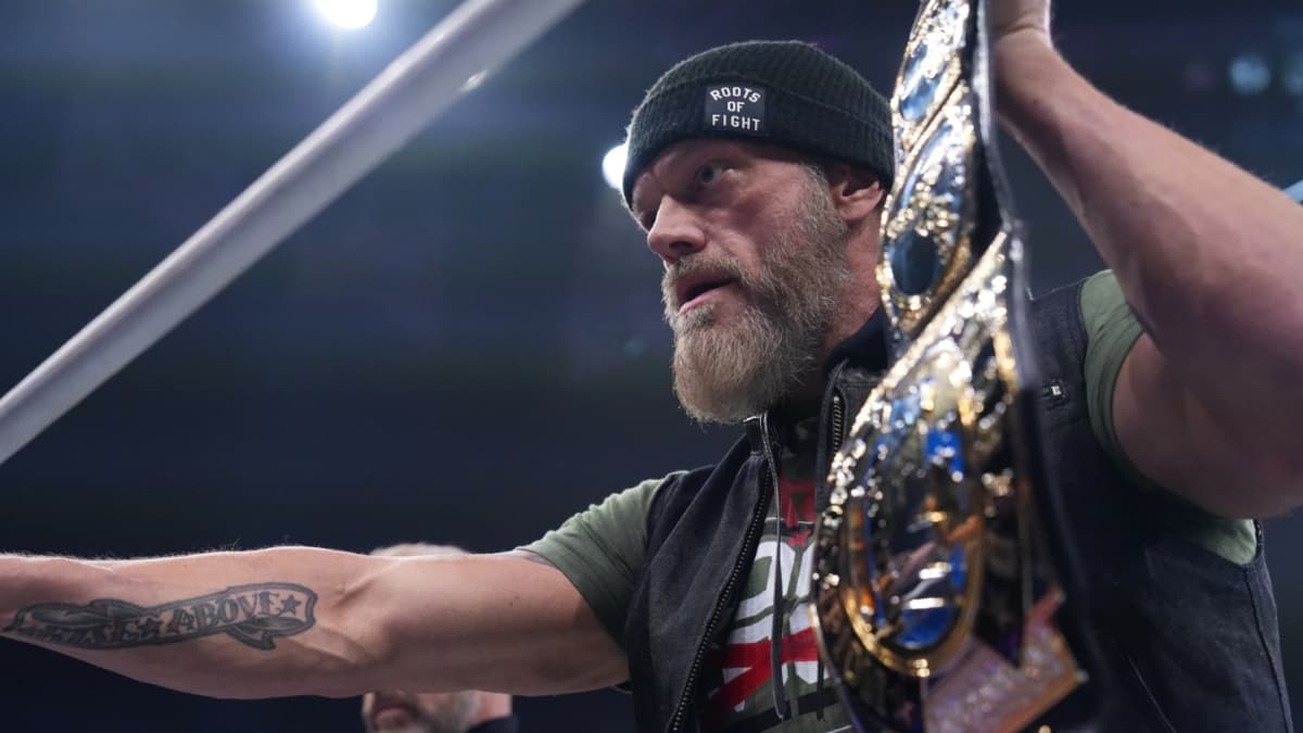 Adam Copeland holding the AEW World Tag Team Title