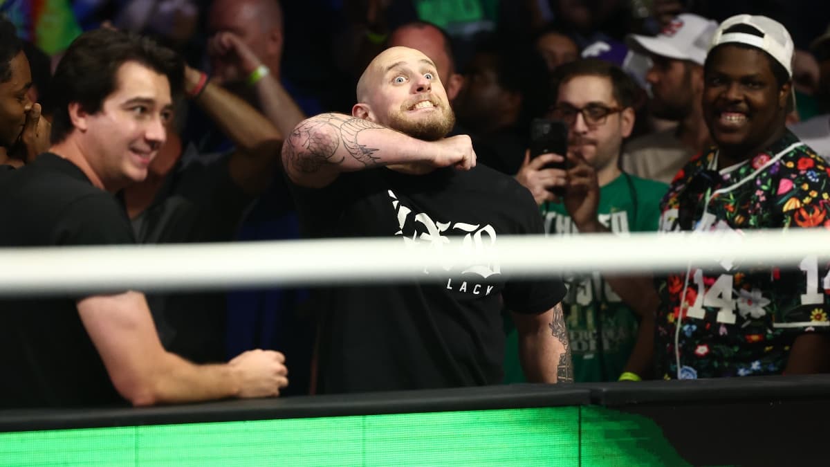 AEW All In putting his arm across his throat