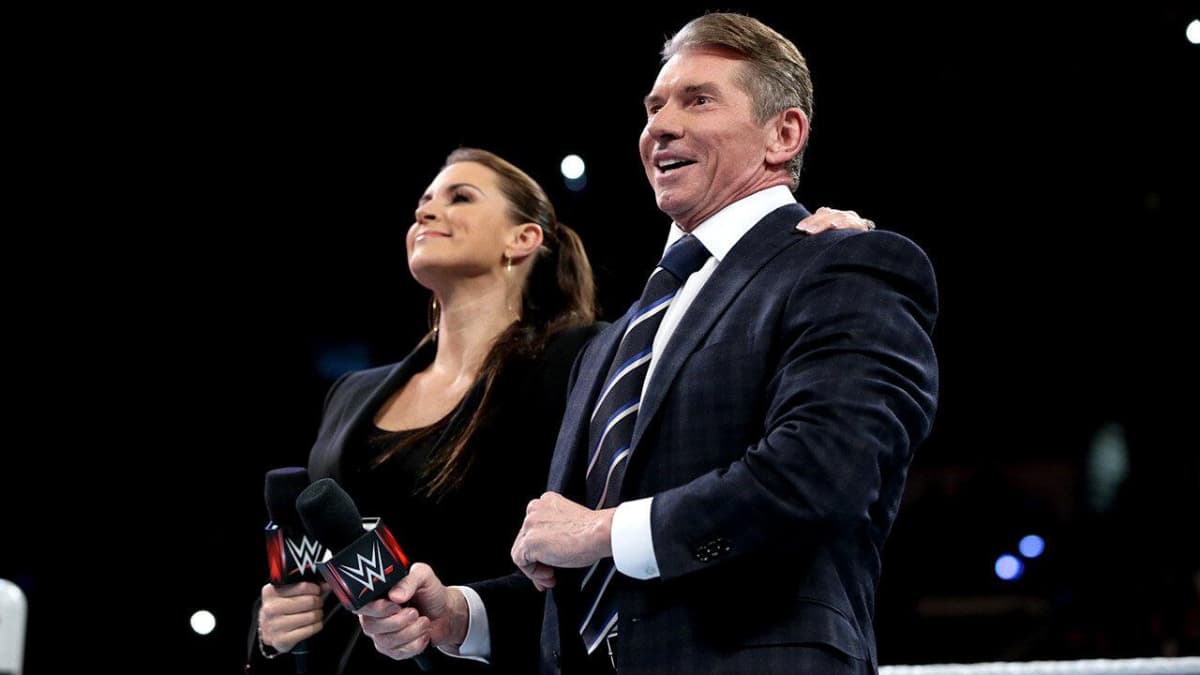 Vince McMahon and Stephanie McMahon smiling and laughing together on January 11, 2016 episode of WWE Raw