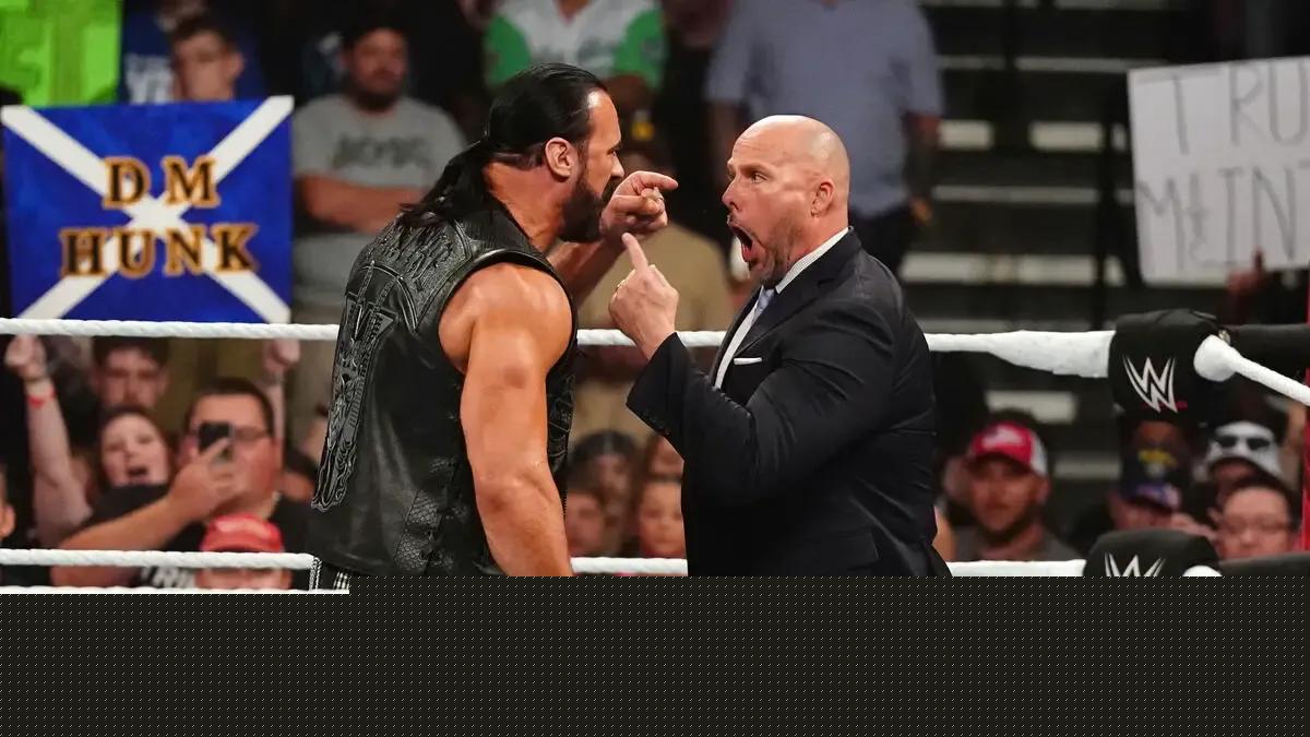 Adam Pearce Drew McIntyre mouth wide open like Creed with their arms.jpg