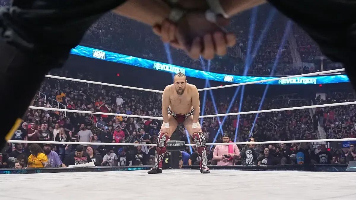 Bryan Danielson March 2024 Revolution through Eddie Kingston-s legs.jpg