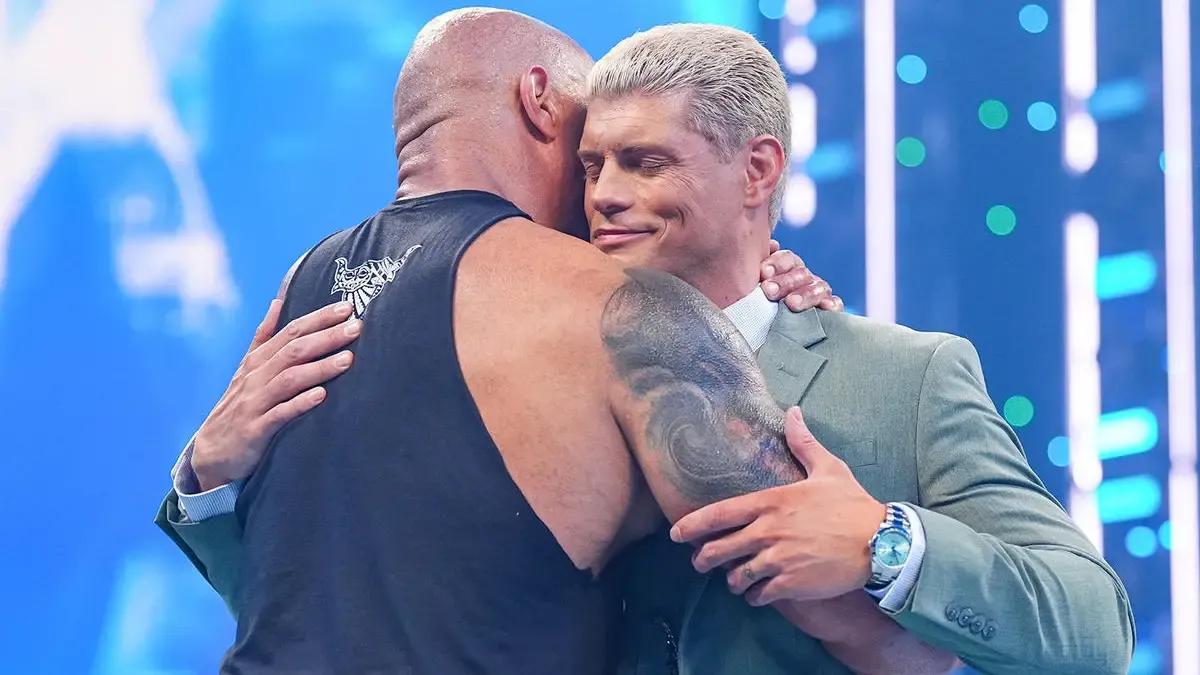 Cody Rhodes January 2024 hugging The Rock trying to keep the pain away.jpg