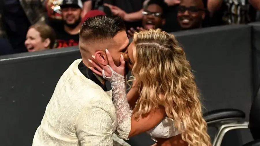 Corey Graves Carmella smooching.jpg