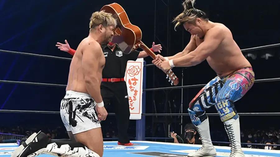 KENTA Wrestle Kingdom 16 Tanahashi guitar shot.jpg