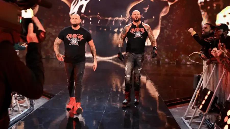 Karl Anderson Luke Gallows storming to the ring WWE return.png