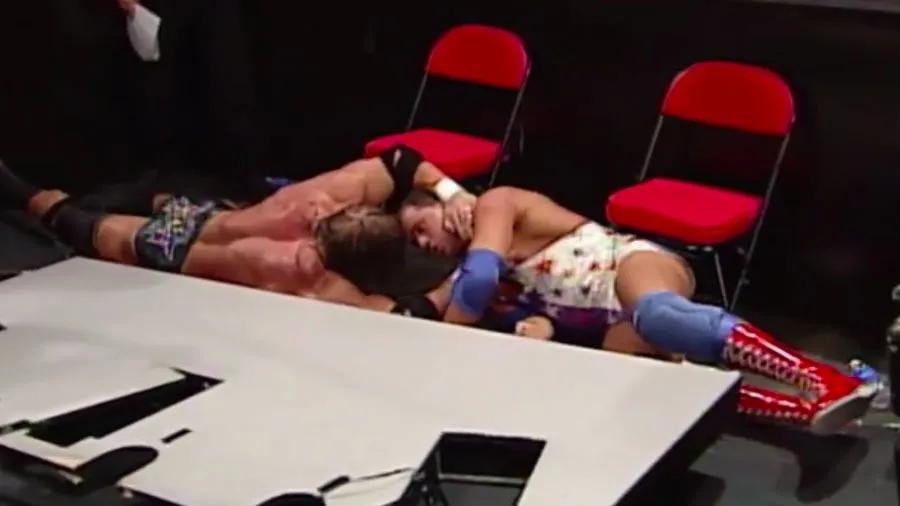 Kurt Angle Triple H SummerSlam 2000 announce table.jpg