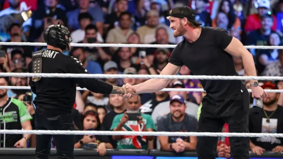 Rey Mysterio shaking hands with Logan Paul.jpg