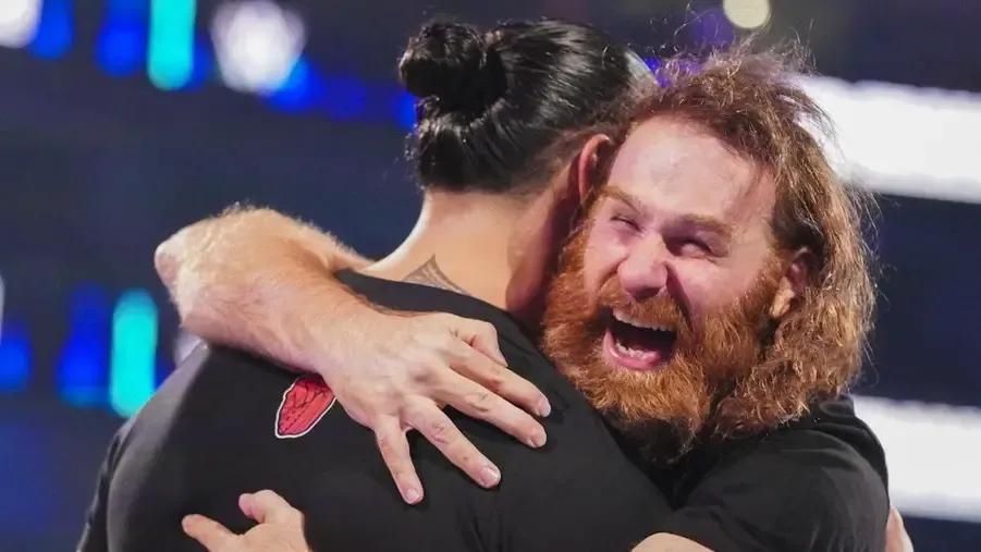 Sami Zayn hugging Roman Reigns.jpg