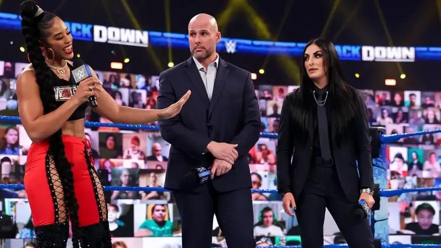 Sonya Deville with Adam Pearce- Smackdown March 2021.jpg