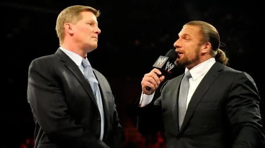 WWE Raw 2012- Triple H- John Laurinaitis.jpg