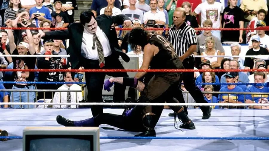 https://cultaholic.com/files/images/5ac364b1c02789df4306d670045a2a0fdad62ad1-the-undertaker-mankind-paul-bearer-summmerslam-1996.jpg