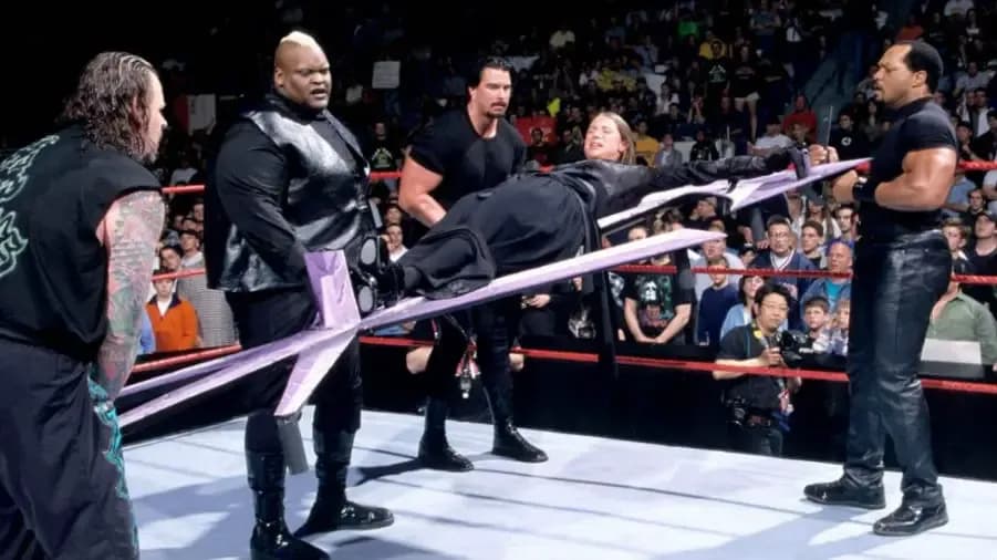 https://cultaholic.com/files/images/5e55e9d6ddf8fc05f6b4501545cb3aafe7a0da77-undertaker-stephanie-mcmahon-faarooq-bradshaw-viscera-unholy-marriage.jpg
