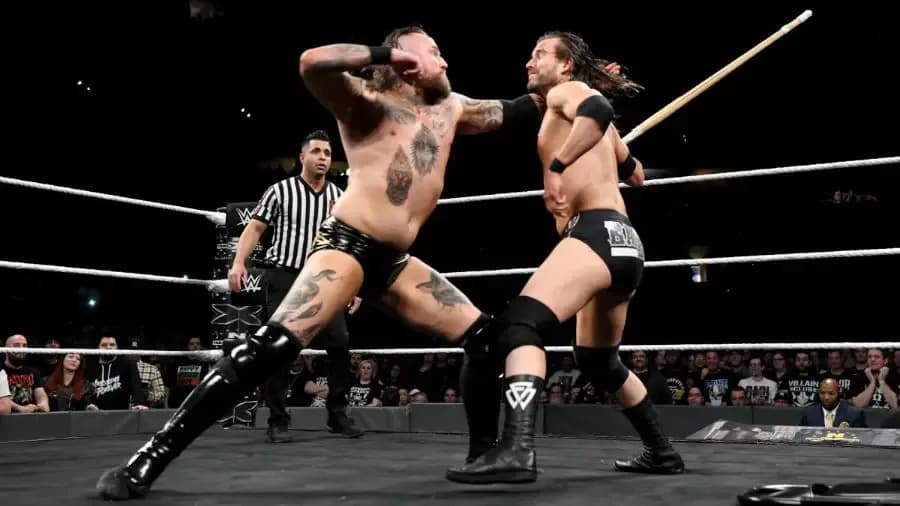 https://cultaholic.com/files/images/7268a0b2973e6269a6e357b9ce7d0643004ed4a5-Aleister-Black-Adam-Cole.jpg