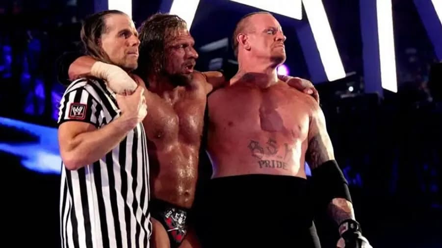 https://cultaholic.com/files/images/9ca63823c301ddbe6c4b48651f2dceec33728f48-the-undertaker-triple-h-shawn-michaels-wrestlemania-28.jpg