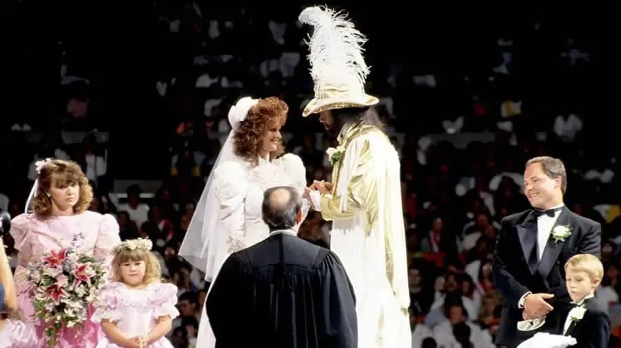 https://cultaholic.com/files/images/a98281dd652290ab7e7d5198361b0df501dcba1d-elizabeth-macho-man-wedding-summerslam-1991.jpg